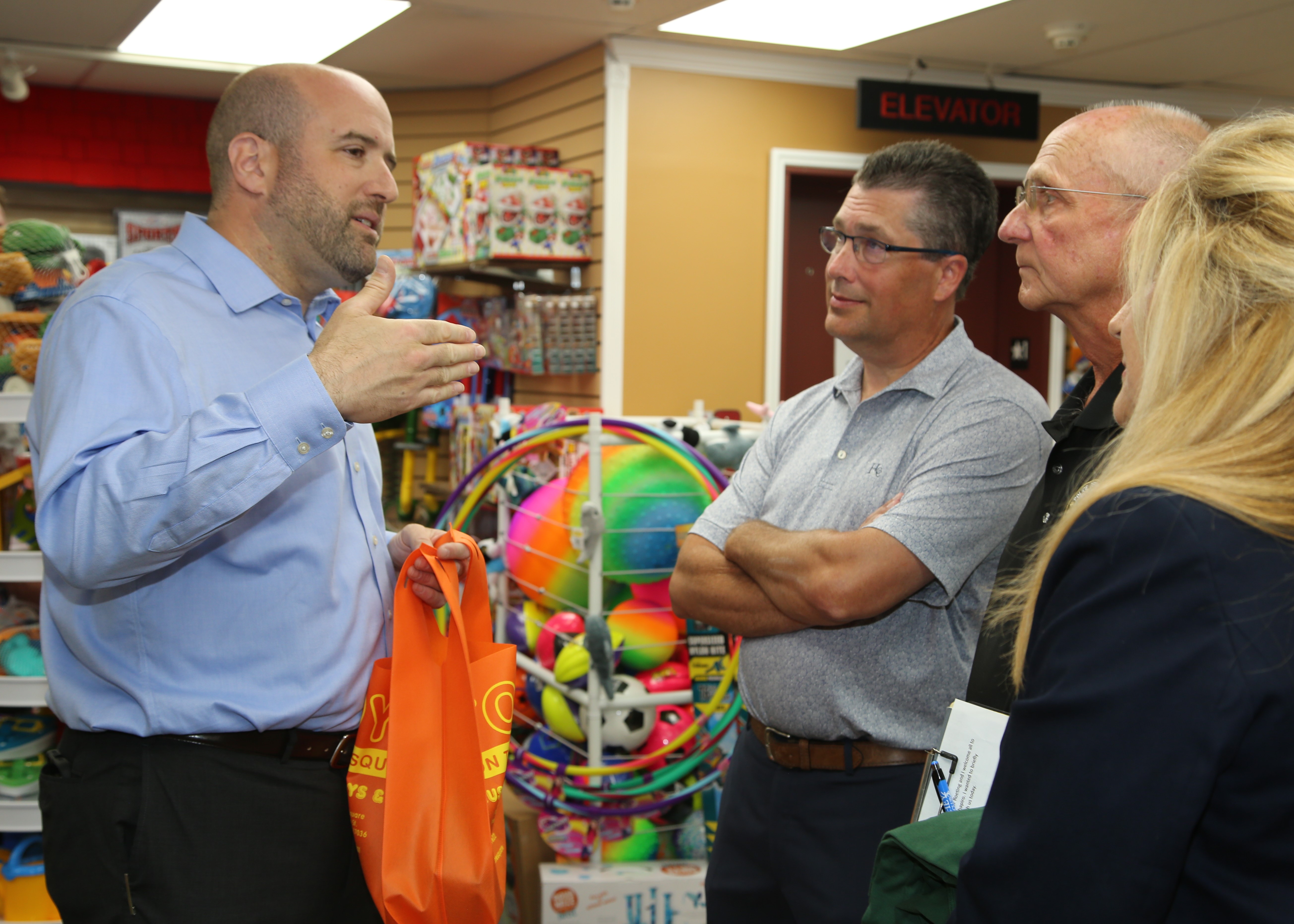 Pictured, from left, are DCED Secretary Rick Siger, Rep. Tom Mehaffie, Hummelstown Mayor David Roeting and Hummelstown Borough Manager Theresa Eberly in conversation at Toys On The Square in June.